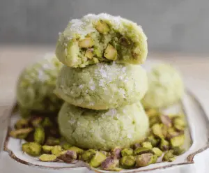 Delicious pistachio wedding cookies with a golden, nutty exterior and a hint of green, perfect for special occasions and gift-giving.