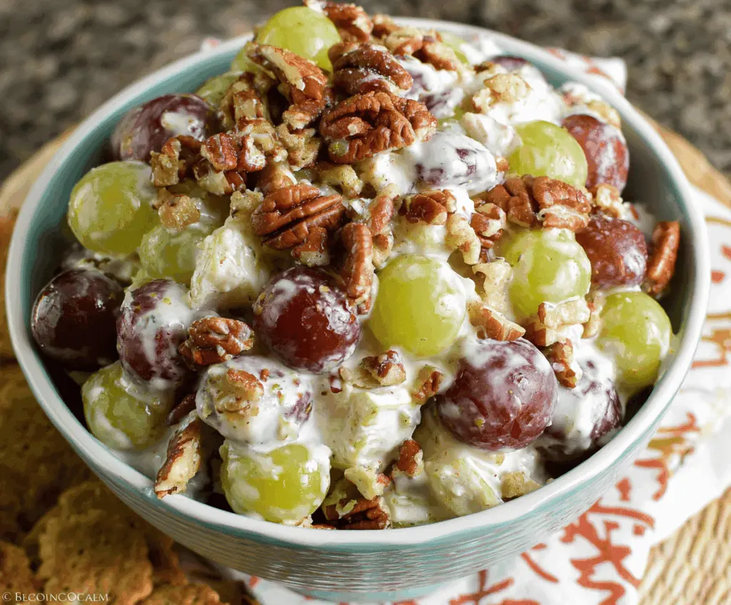 Delicious Pecan Crunch Grape Salad with fresh grapes, crunchy pecans, and a sweet dressing.
