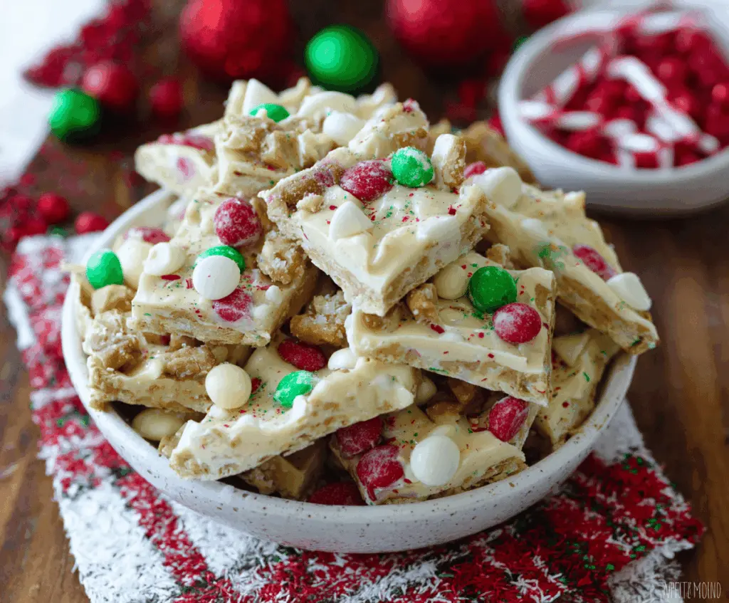 Delicious White Chocolate Christmas Crack with festive toppings on a holiday plate.