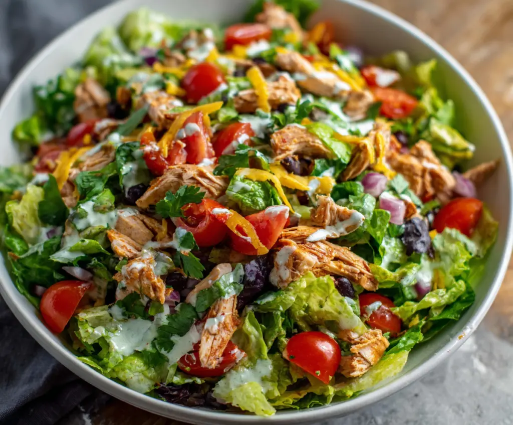 Colorful Taco Chicken Salad with fresh vegetables and seasoned chicken slices
